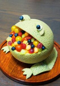 A dummy frog and in the frogs mouth there is candy's 